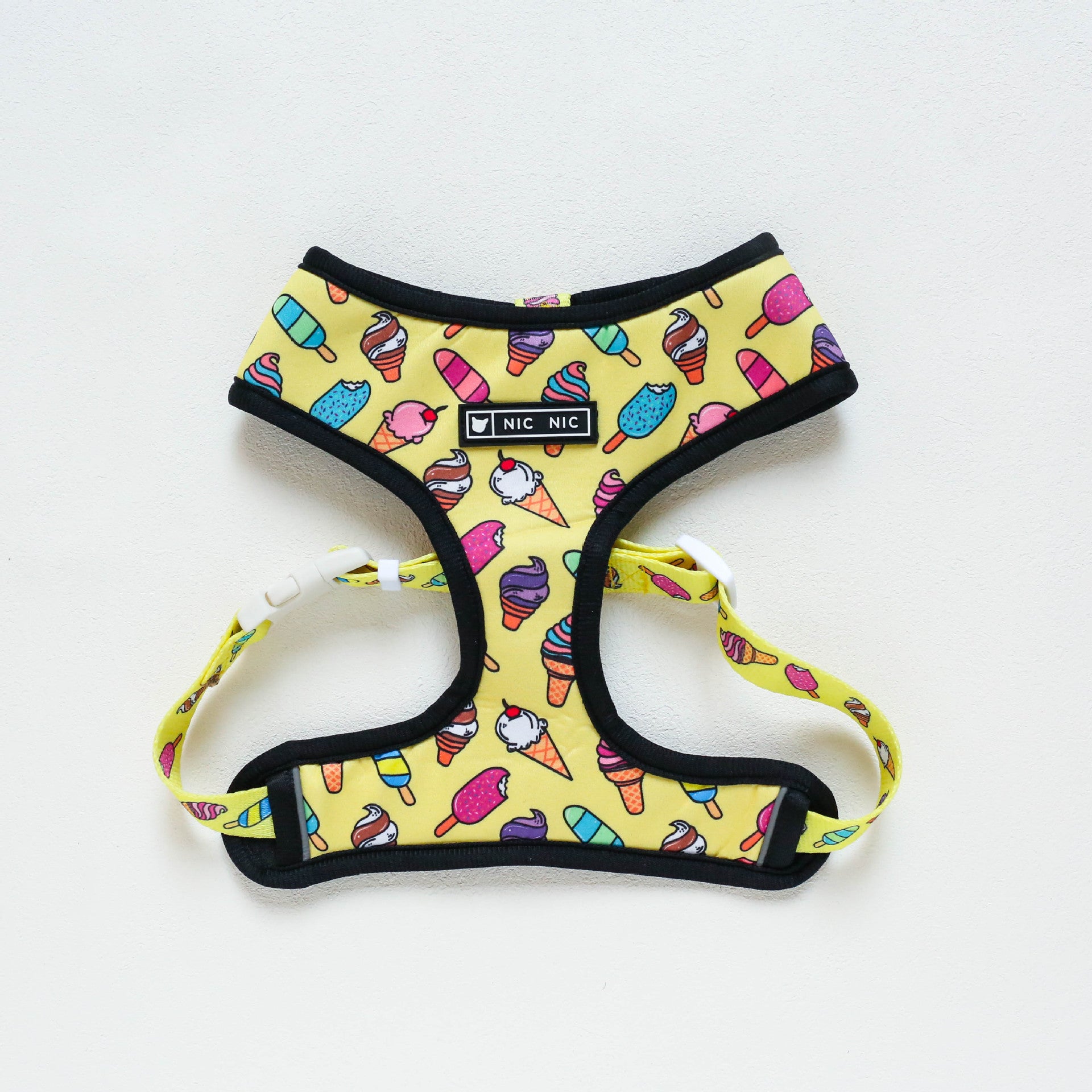 Dog harness with ice cream pattern on a white background