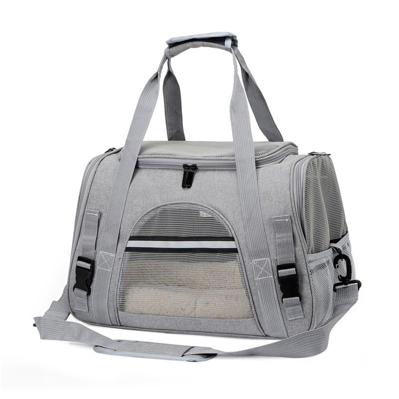 Gray pet carrier with mesh front on a white background