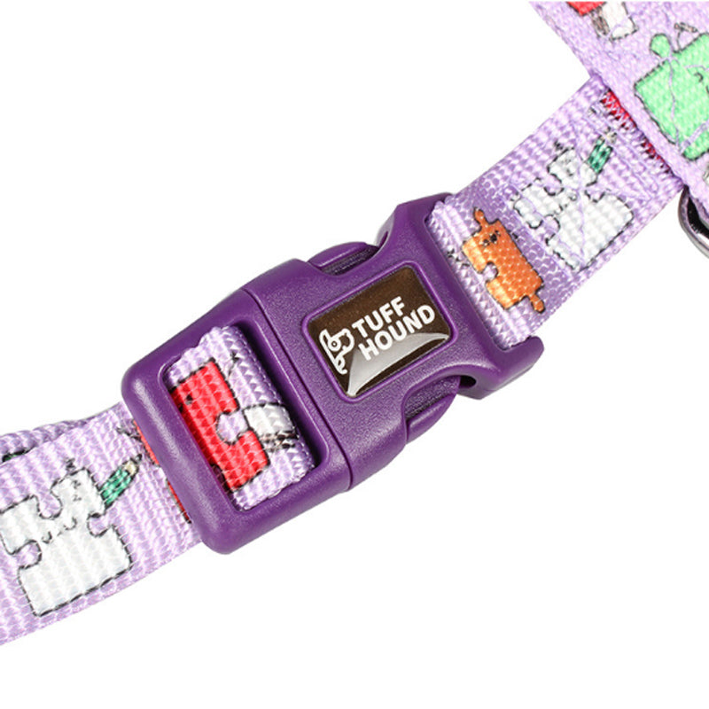 Dog collar with colorful pattern and purple buckle on a white background