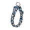 Floral-patterned dog collar with a metal clasp on a white background