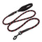 Black dog leash with red speckles on a white background