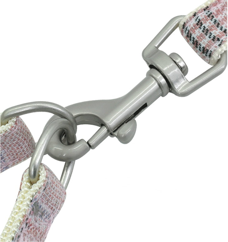 Close-up of a dog collar with a metal clasp on a white background