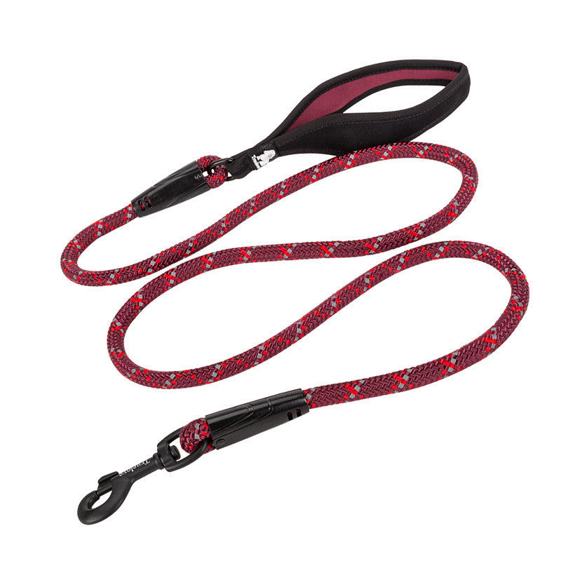 Red patterned dog leash with black clip on a white background
