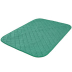 Green quilted mat on a white background