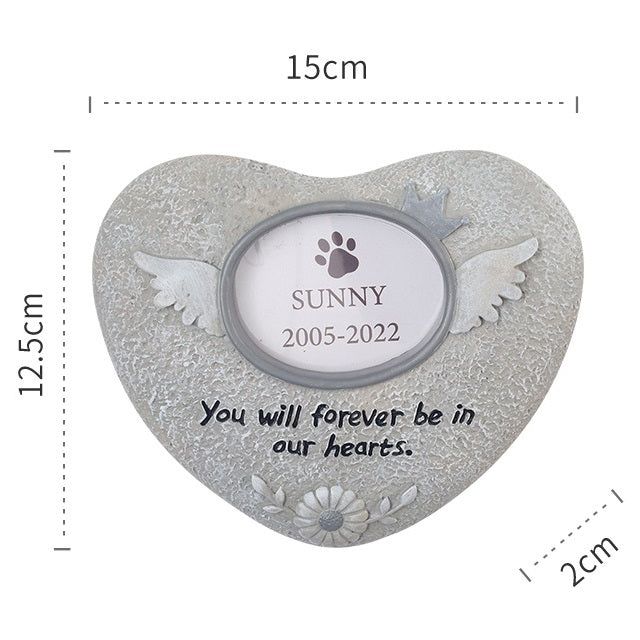 Heart-shaped pet memorial with wings, paw print, and text dimensions shown
