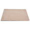 Beige bath mat on a white background