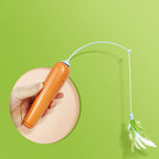 Orange electronic pet toy with a string and feathers on a green background