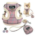 Dog harness, leash, and tag set with plaid pattern on a white background