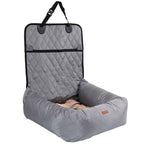 Gray car seat cover with quilted design and storage pocket on a white background