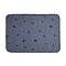 Gray pet mat with black paw print pattern on a white background