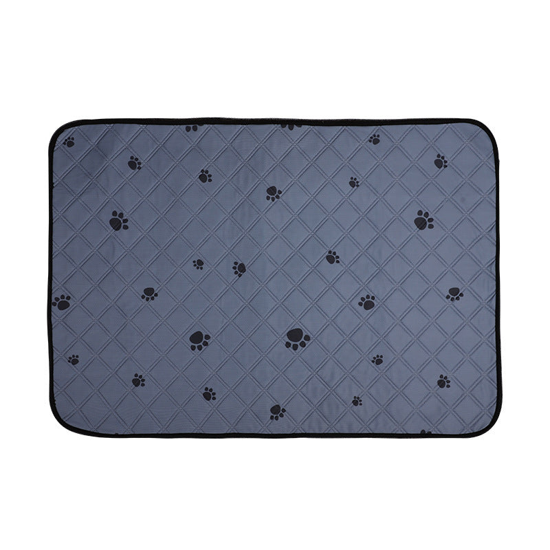 Gray pet mat with black paw print pattern on a white background