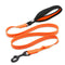 Orange dog leash with black clip on a white background