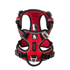 Red dog harness with black straps on a white background